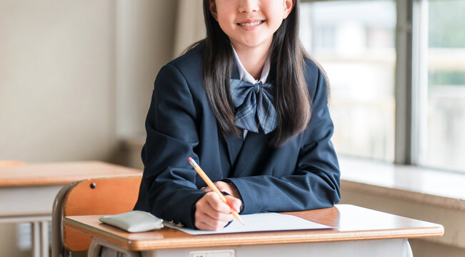 Elementary, middle, and high school girls taking tests in school classrooms or cram school classes.