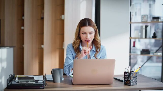 Relaxed manager making break sitting office chair holding coffee cup closeup.