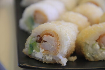 Panko shrimp maki rolls with avocado and cheese © kike