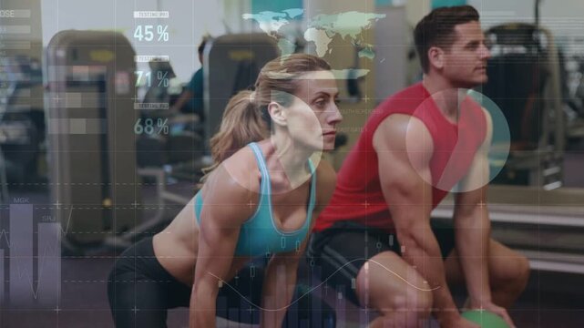 Woman and man rising from held medicine-ball squat after hold, with HUD charts tracking fitness