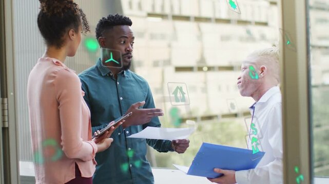 Center man explaining plan and pointing paper on glass, holographic green energy icons clustering