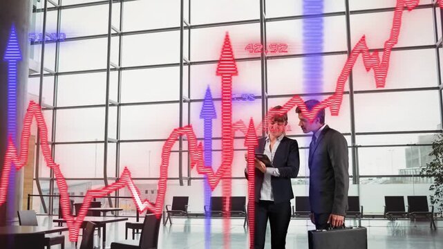 2 biz pros shaking hands checking tablet atrium red chart blue arrows overlaying scene closing deal