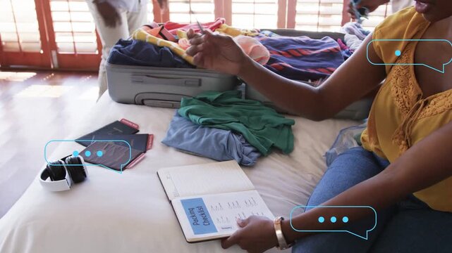 Mom tapping list, marking items, man packing suitcase, son helping, speech bubbles guiding travel