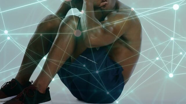 Man starting supine, doing crunches on studio floor with animated network showing core for fitness