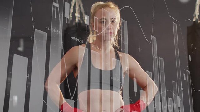 Athlete standing in gym camera zooming causing financial charts crossing torso visualizing metrics