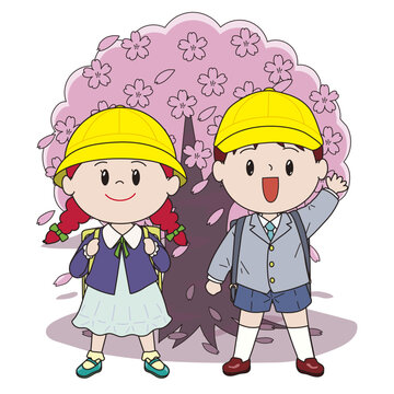 桜の前に立つ小学生の男の子と女の子