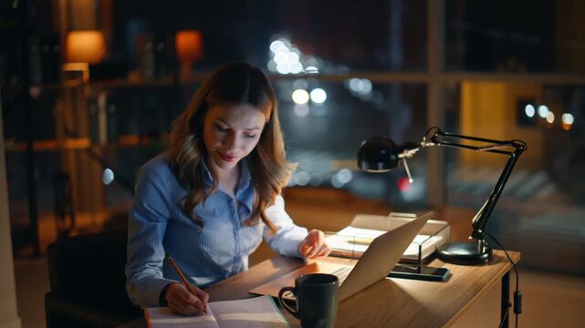 Successful founder creating project sitting night office closeup. Smiling woman 