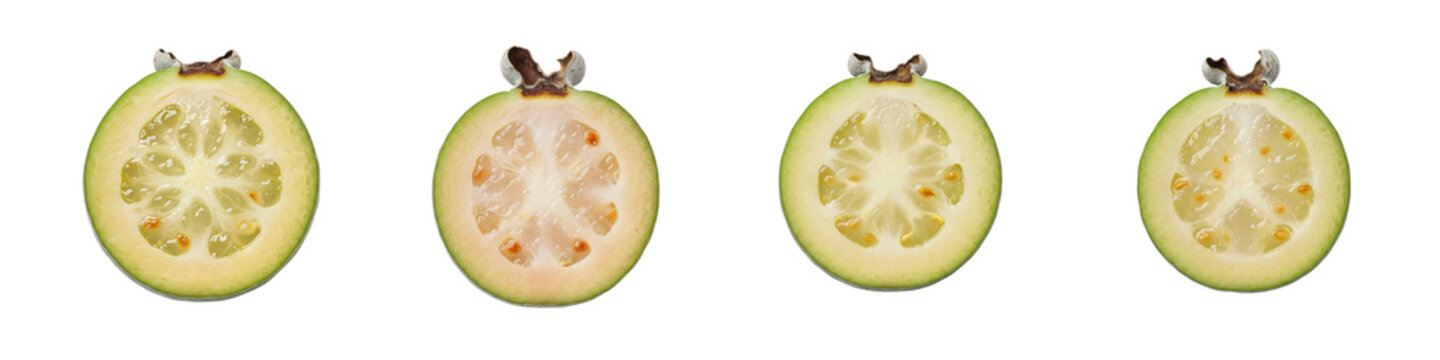 Collection of fresh feijoa fruit halves isolated on a black background