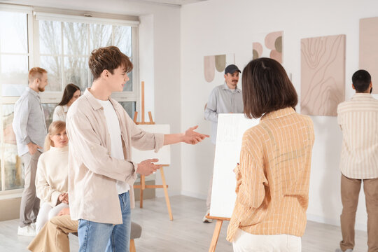 Group of people at art gallery exhibition