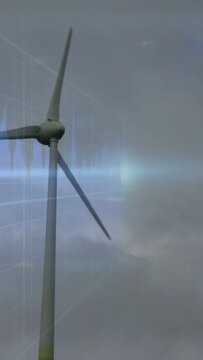 Vertical video: Wind gusts driving solo turbine blades turning while data overlay showing output