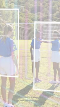 Vertical video: Right player stepping hand-on-peer starting foot-tap soccer drill AR ball by goal