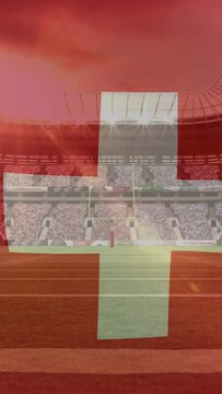 Vertical video: Stadium lights cueing red overlay, white cross shifting and tilting to reveal pitch