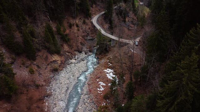Aerial: above Pochtenkessel deep rock funnel during the day near Adelboden, canton of Bern, Switzerland, orbit drone shot
