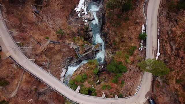 Aerial: bird's eye view drone shot of Pochtenkessel deep rock funnel during the day near Adelboden, canton of Bern, Switzerland