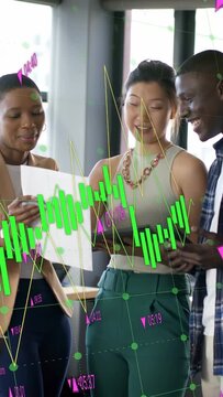 Vertical video: Team reviewing paper and tapping devices, sparking market overlay obscuring screens