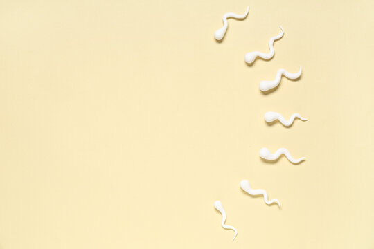 Sperm cells on beige background