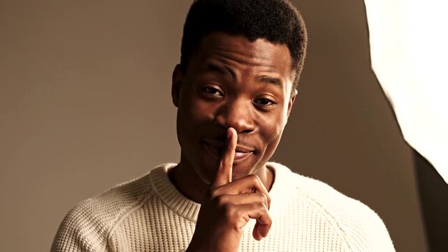 Smiling Man with Finger Raised.