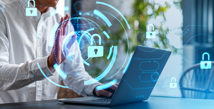 Man working on laptop with glowing digital security elements in a photographic style on a bright indoor background, concept of data protection