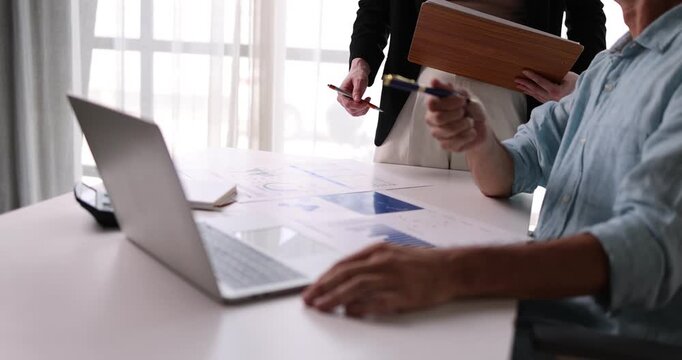 Analyze financial data and accounting record with calculator in meeting office, Accounting company charts and graphs banner, double exposure successful business finance and taxation planning concept.