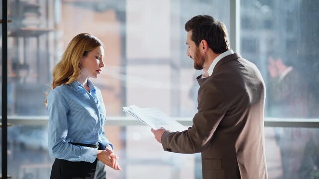 Angry executive reprimanding manager complaining mistake standing office closeup
