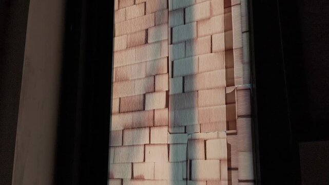 Vertical Projection Mapped Brick Pattern Wall Installation With Dark Framing