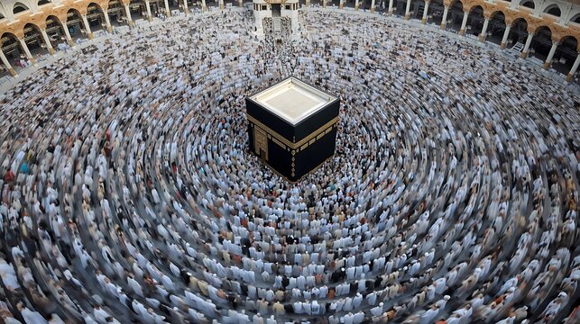 Aerial view of a massive crowd of pilgrims circumambulating the Kaaba during Hajj, Mecca, Saudi Arabia, surrounded by ancient architecture