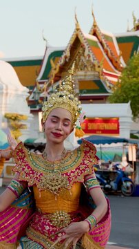 Traditional Thai Khon Dancer Performs in Ornate Costume at Bangkok Temple