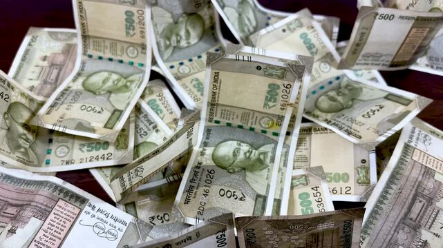 Indian Rupee currency notes, pile of 500 INR banknotes, scattered cash for financial concepts, wealth and banking in India