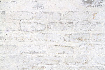 Fototapeta premium An old light brick wall. The texture of old whitewashed brickwork.