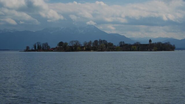 Scenic view of Fraueninsel island with the monastery towers seen from Gstadt, Chiemsee Bavaria.