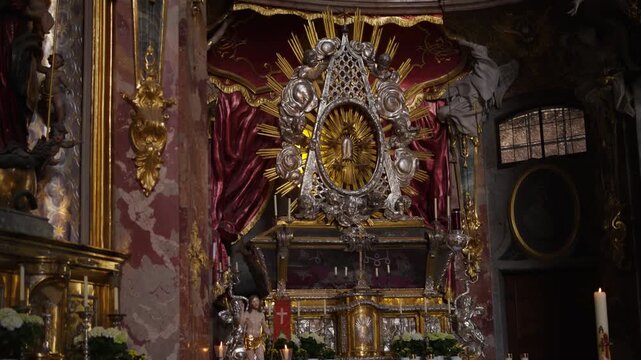Interior of the Asam Church in Munich with golden altar and ornate Rococo decorations, St. Nepomuk