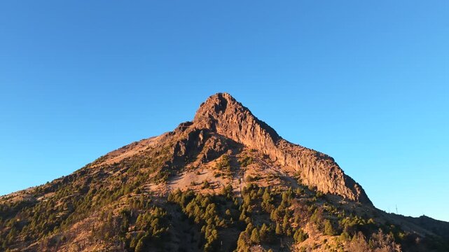 Nevado de Colima, Jalisco and Colima, Mexico - A Volcanic Mountain That Rises Majestically With Its Rugged Slopes and Forested Base - Aerial Pullback Shot