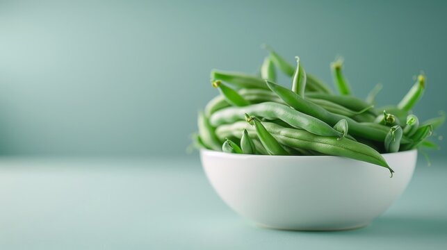 String bean-based snack such as roasted beans or bean chips, set against a clean, simple background.