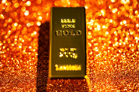 Gold bar macro texture luxury. Gold bullion precious metal asset. Gold financial market investment value. Gold safe reserve wealth concept.