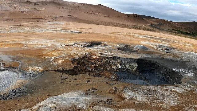 Bubbling mud pots and steaming vents at Hverir geothermal area, Iceland