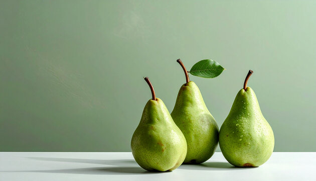 Monochrome Sage %26 Pear- Green pears against a matching sage-green matte background