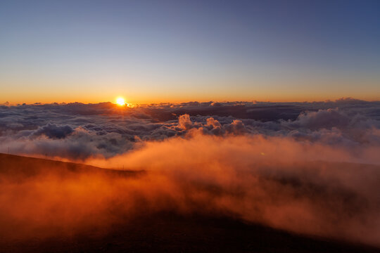 Sunset above clouds from volcano in Hawaii