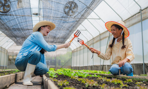 Portrait of teenage girl playing in the vegetable garden