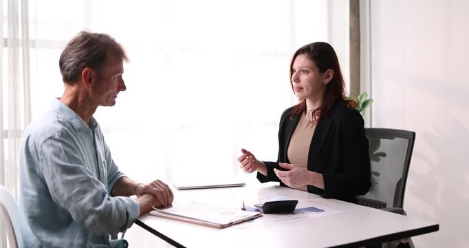 Auditor and accountant team working in office, analyze financial data and accounting record with calculator. Accounting company provide finance and taxation planning for profitable cash flow.

