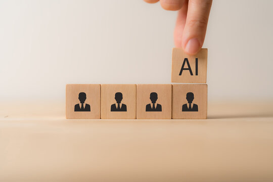 Artificial intelligence transforming human resources. Placing AI wooden blocks among human icons. AI transforming human resources, recruitment automation, workforce transformation, the future of work.