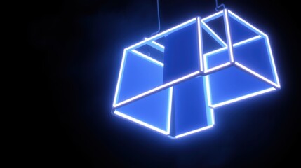 Fototapeta premium Bright blue neon sculpture hangs suspended. Geometric shapes intersect, creating abstract form against dark background. Minimalist design, modern aesthetic.