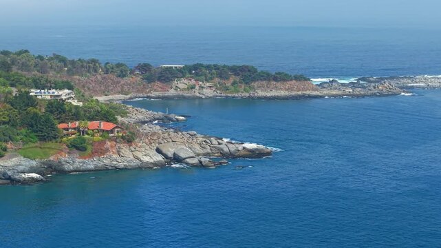 Exclusive homes on the rocks in Punta Pite, Papudo, Chile. Aerial view
