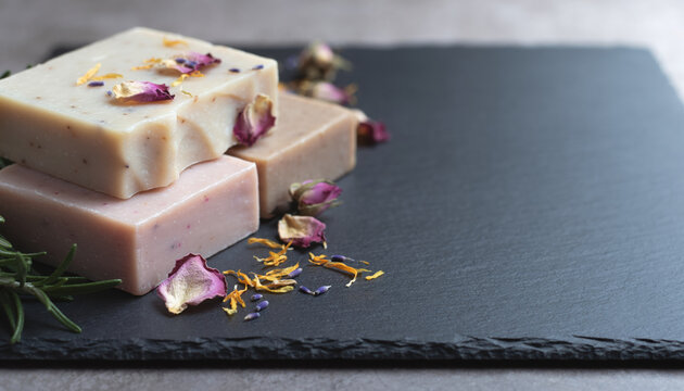 Natural soap bar handmade soap organic soap soap bar floral soap rose petal slate background spa concept closeup of natural