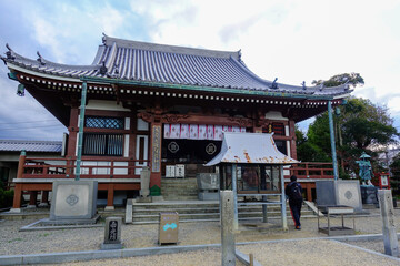 Naklejka premium Large Buddhist temple hall with tiled roof on Shikoku Henro pilgrimage route in Japan