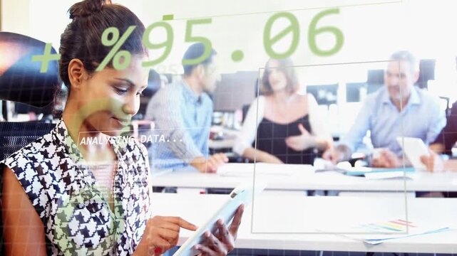 Analyst tapping tablet and initiating green percentages ANALYSING DATA updating for business team