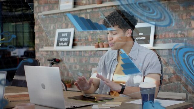 Man at desk reacting to HUD overlay, typing on laptop, tapping, sorting cards and organizing ideas