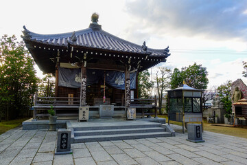 Fototapeta premium Small Buddhist temple hall with stone courtyard on Shikoku Henro pilgrimage route in Japan