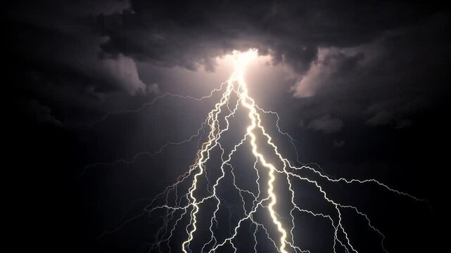 Powerful lightning storm with multiple bright lightning bolts striking through dark cloudy sky at night