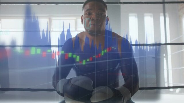 Boxer raising glove lowering rising in ring showing focus market chart overlay over boxer shifting
