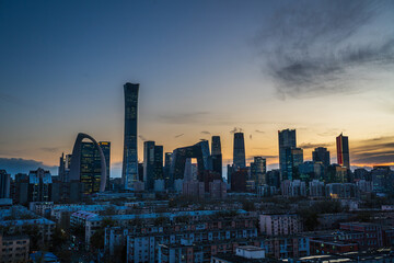 Cityscape of Beijing Central Business District (CBD) at sunset with a vibrant afterglow © 文普 王